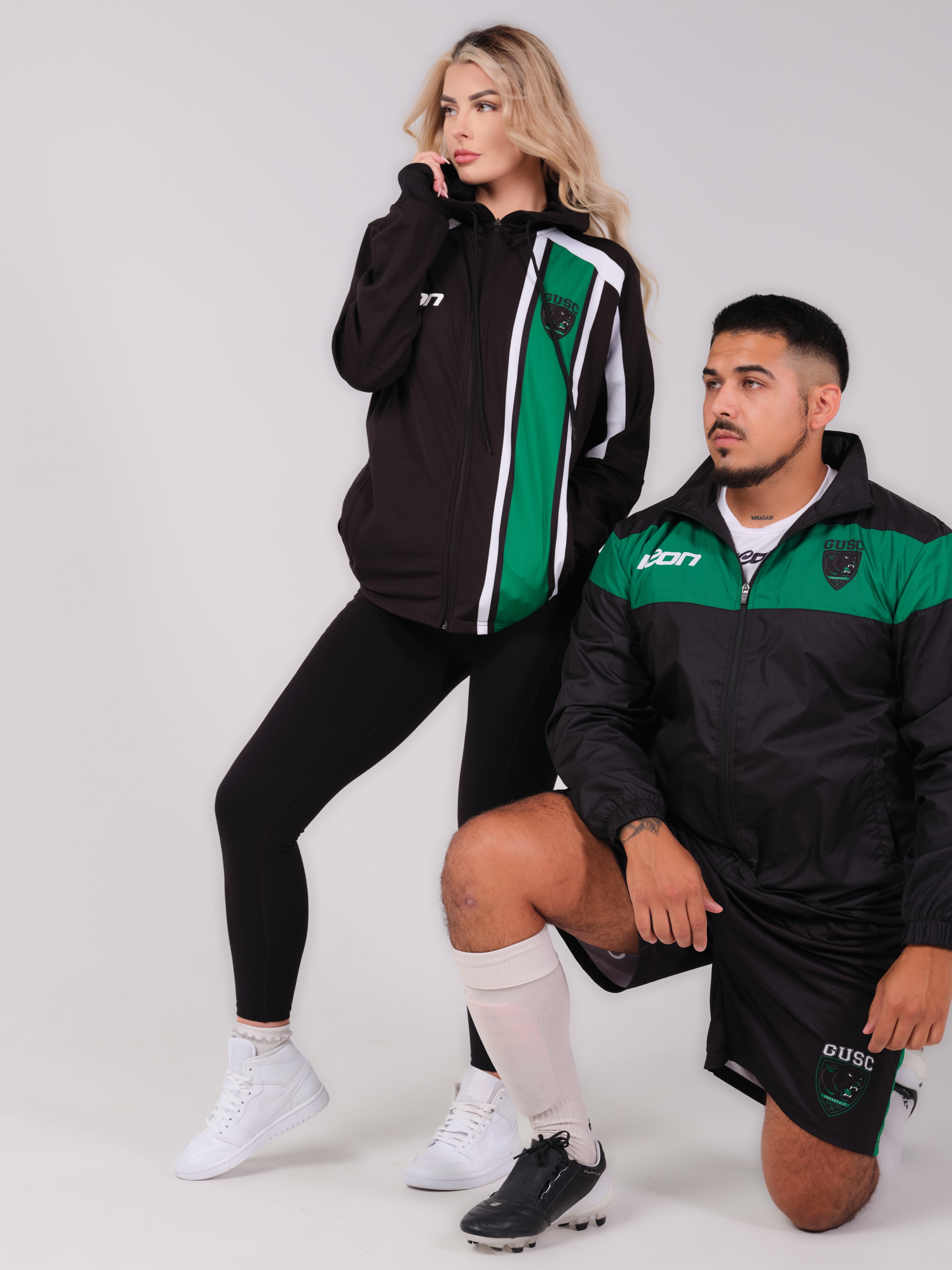 Athletes wearing coordinated black and green ICON club jackets