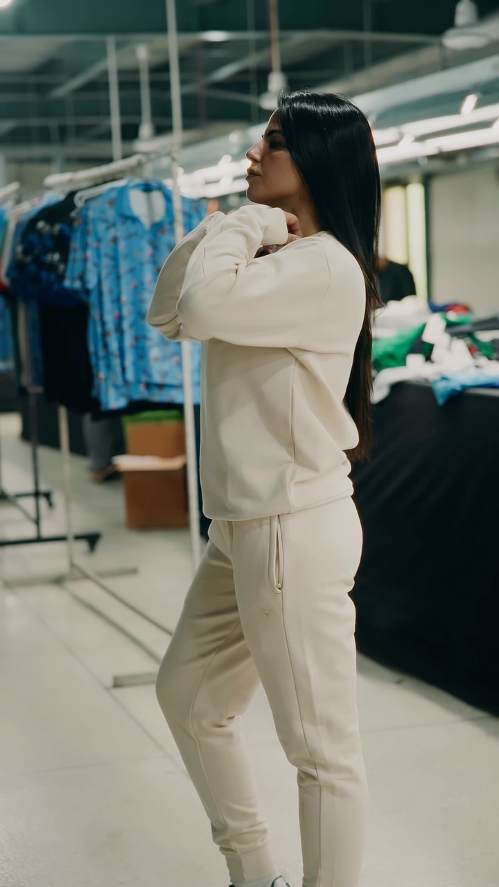Athlete wearing a cream ICON leisure tracksuit